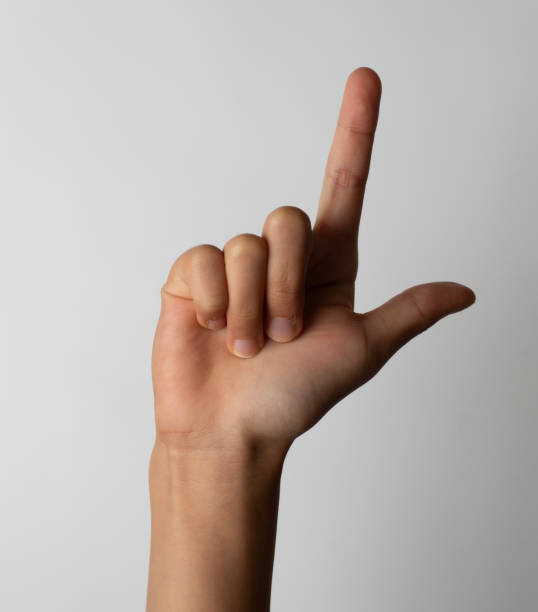 lenguaje de señas americano letra l alfabeto con la mano de los niños - letter l human hand human finger human thumb fotografías e imágenes de stock