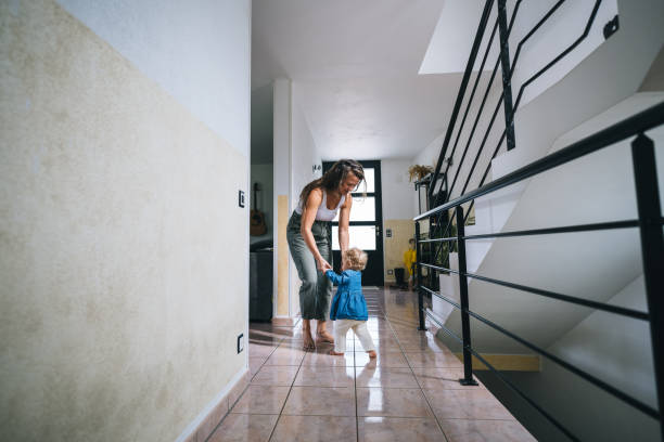 istock Mother helps baby walk 1682883570