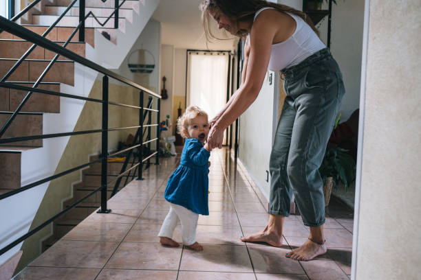 istock Mother helps baby walk 1682883572