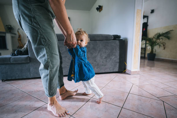 istock Mother helps baby walk 1682884620