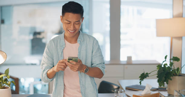 istock Smartphone, business or Asian man with connection, typing and email notification with digital app, internet or chatting. Japanese person, employee or consultant with a cellphone, smile or mobile user 1682902344