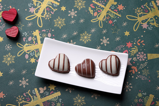 Heart Shaped Chocolate on  Christmas Paper