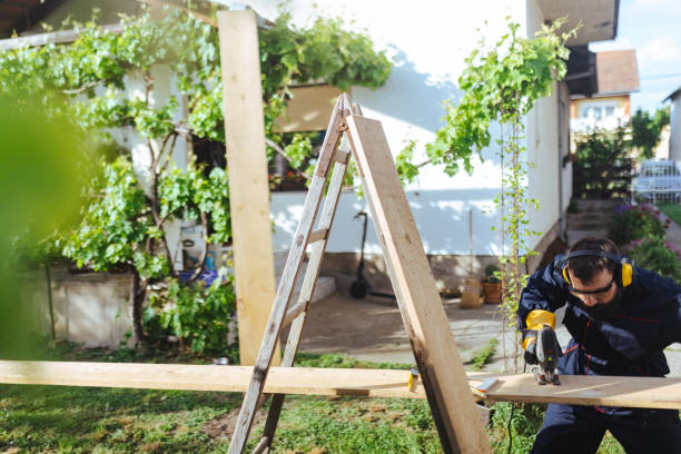 istock A blue collar worker uses a jigsaw in the yard while renovating the house 1682933304