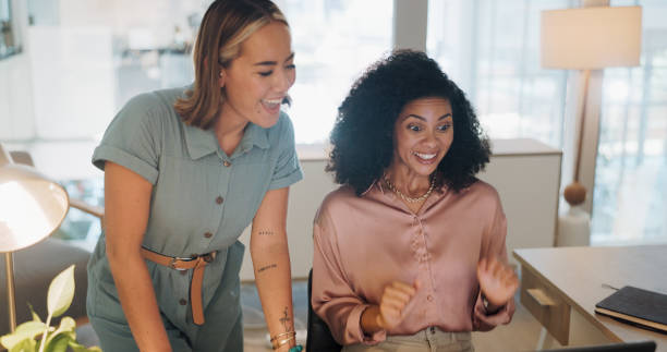 istock Teamwork, success and business people celebrate for laptop learning, training and problem solving. Happy, celebration and winner hand sign of marketing women and manager on solution, goals or mission 1682934937