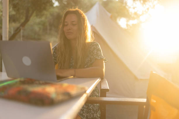 istock Business woman enjoying the sunset while working remotely 1682941931