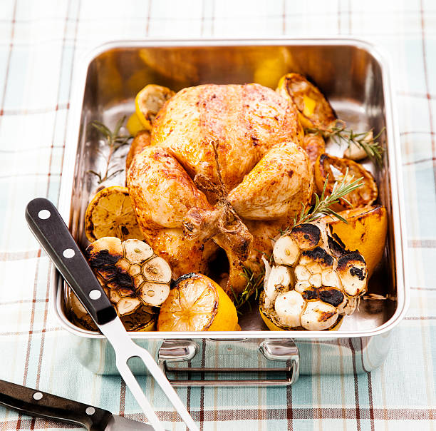 istock Roasted Chicken Dinner with Lemon, Potatoes, Carrots and Rosemary 168301690