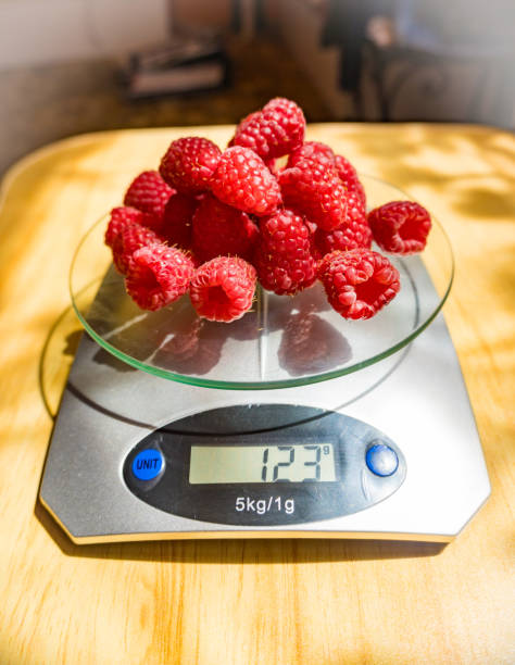 istock fresh rapsberries on a digital nutrition diet scale, healthy eating concept 1683018058