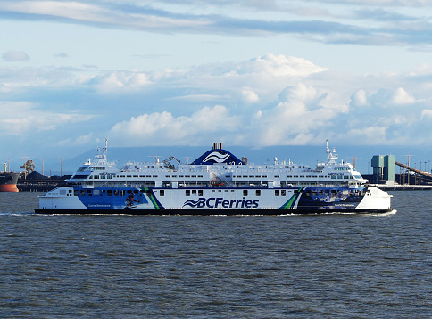 Vancouver, BC, Canada July 2023 A ferry owned by BC Ferries is traveling to Victoria BC. The ferry has skiing paint theme.