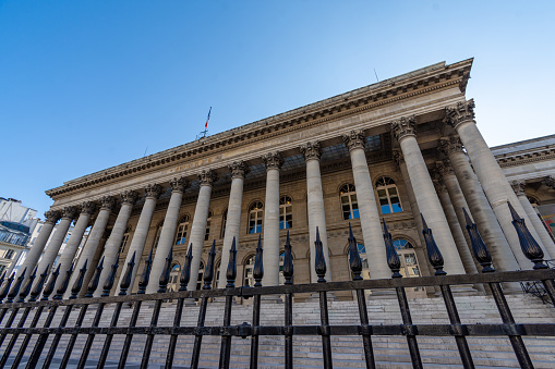 Paris, France - September 15, 2023: Exterior view of the facade of the Palais Brongniart, a building that previously housed the Paris Stock Exchange. Concepts of financial markets and global finance