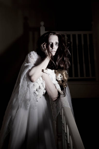 istock Ghost of crazy woman with a doll 168304174