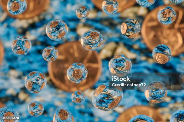 Lucky Pennies Falling Into A Wishing Well Abstract Stock Photo - Download Image Now