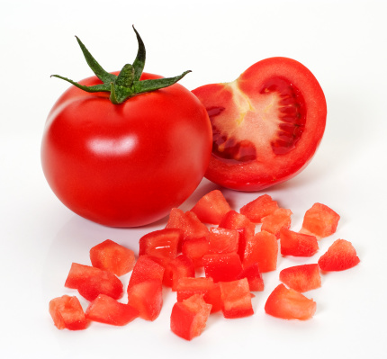 Diced,whole and half tomatoes,on white background