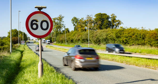 istock Speed limit sign with car passing in motion blur 1683047378
