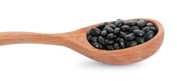 istock Wooden spoon with raw kidney beans isolated on white 1683069066