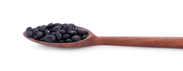 istock Wooden spoon with raw kidney beans isolated on white 1683070185