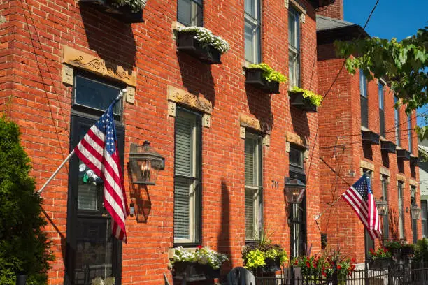 Quaint, old-world style brick facades in German Village in Columbus, Ohio on a sunny summer day