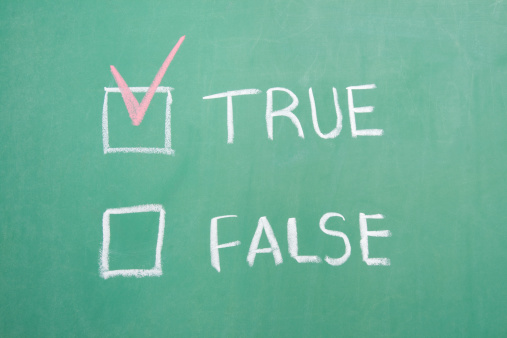 True or False written on a green chalkboard with a check mark next to true.