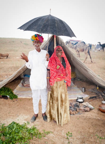 istock Rainy Day at Pushkar Fair - Senior Married Couple 168307764