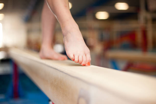 istock Young Gymnast Toes on Balance Beam 168307806