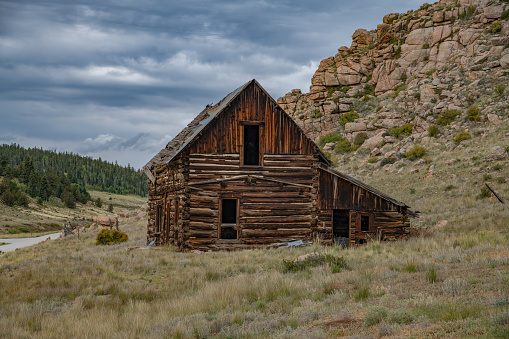 Rocky Mountain log cabin with picture window and 2 doors in Terryall in Colorado in western USA of North America. Nearest cities/towns are Colorado Springs, Denver, Fairplay, and Lake George, Colorado.