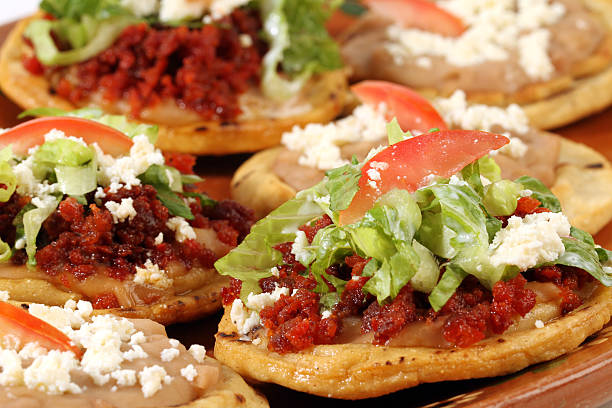 A taco with rice, beans and guacamole. 