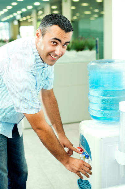 istock Businessman Drinking from Water Cooler 168312863