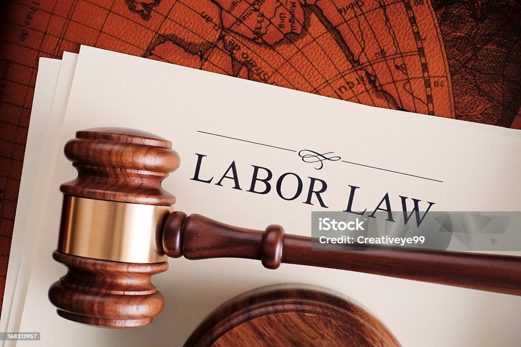 Labor law Gavel on labor law document Employment And Labor Stock Photo