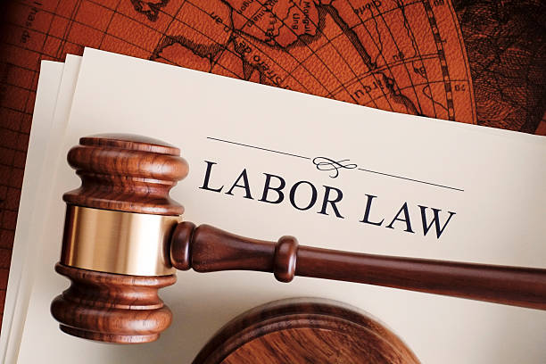Labor law Gavel on labor law document employment and labor stock pictures, royalty-free photos & images