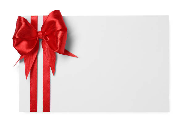 istock Blank gift card with red bow isolated on white, top view 1683140002