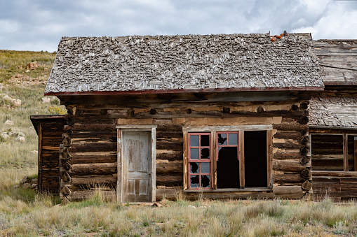 Rocky Mountain log cabin with picture window and 2 doors in Terryall in Colorado in western USA of North America. Nearest cities/towns are Colorado Springs, Denver, Fairplay, and Lake George, Colorado.