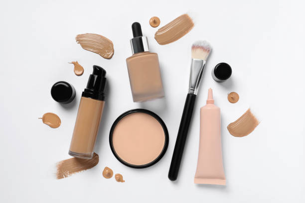 istock Liquid foundations, makeup brush, swatches and face powder on white background, flat lay 1683141101
