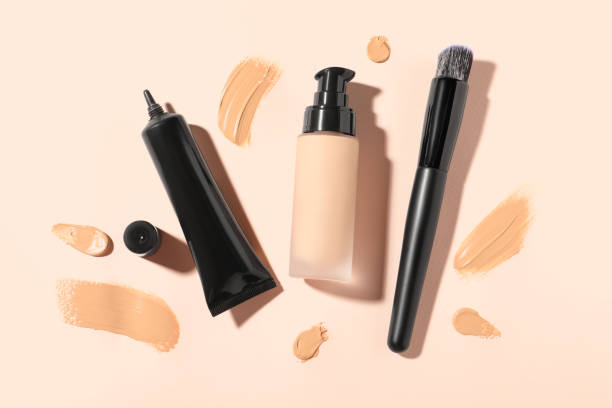 istock Liquid foundations, swatches and makeup brush on beige background, flat lay 1683141113