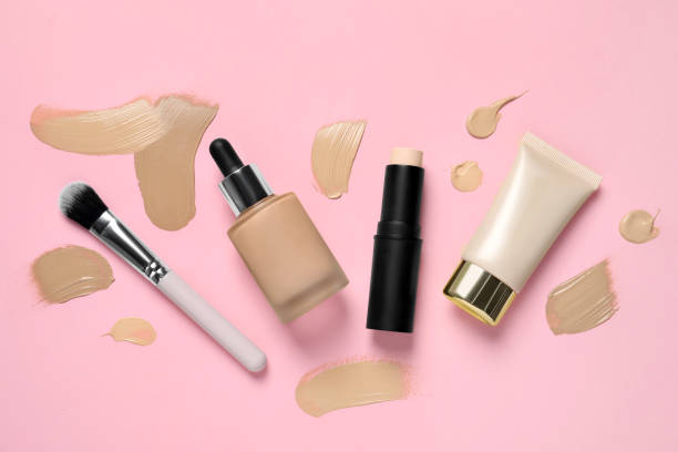 istock Foundations and makeup brush on pink background, flat lay 1683141689