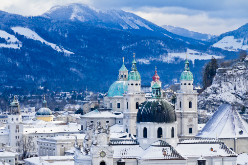 View on steeples and domes of Salzburg after a snowfall, seen from Mönchsberg. The city is renowned for its baroque architecture and has been listed in UNESCO World Heritage Site in 1996. Salzburg, Austria