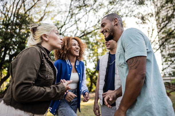 istock Friends talking on the public park 1683168508