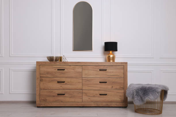 istock Stylish room interior with chest of drawers, mirror and decor elements 1683171175