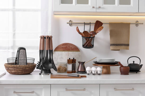 istock Set of different utensils and dishes on countertop in kitchen 1683171245