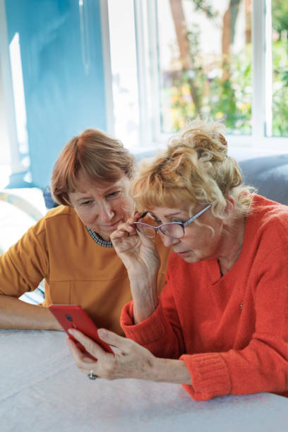 istock The smart way to invest those savings. two elderly women use smartphone while going through finances at home 1683181517