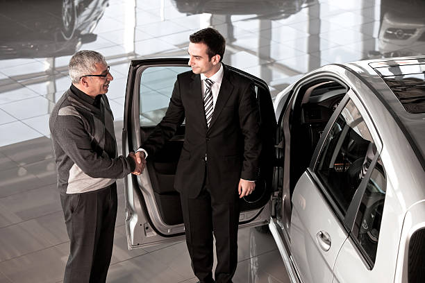 istock Car salesperson with buyer 168318978