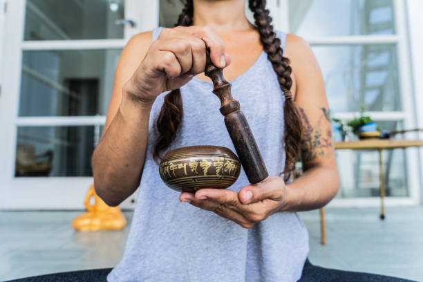 istock Woman playing on Tibetan singing bowl 1683208951