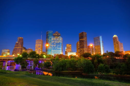 View of the financial district of Houston from the Buffalo Bayou Park during a bright spring day. 