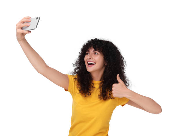 istock Beautiful young woman taking selfie on white background 1683217059