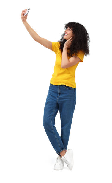 istock Beautiful young woman taking selfie on white background 1683217589