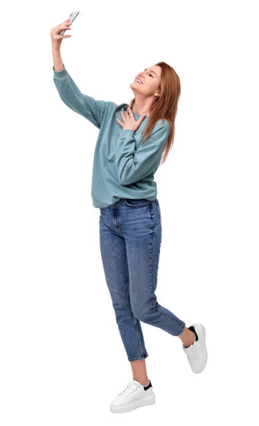 istock Beautiful woman taking selfie on white background 1683225533
