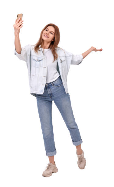 istock Beautiful woman taking selfie on white background 1683225536