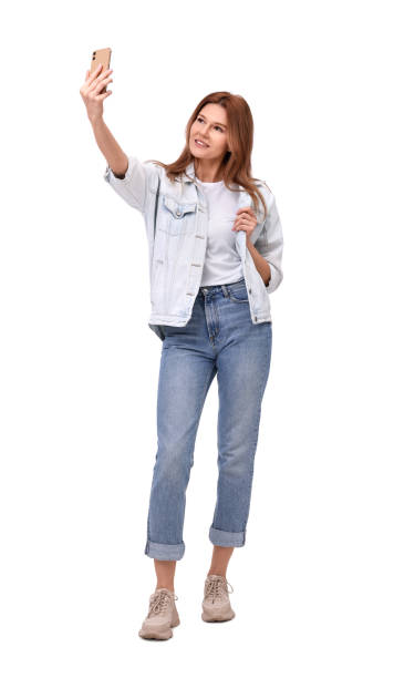 istock Beautiful woman taking selfie on white background 1683225537