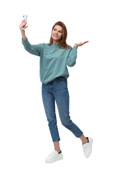 istock Beautiful woman taking selfie on white background 1683226082