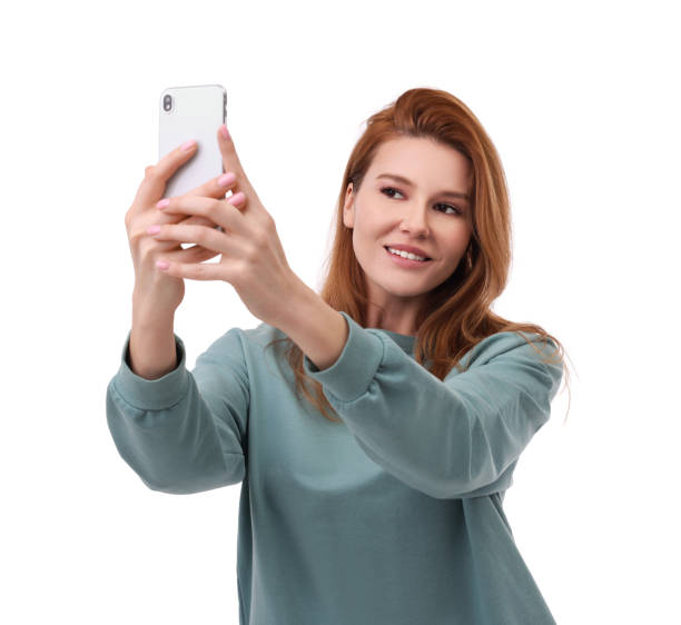 istock Beautiful woman taking selfie on white background 1683226416