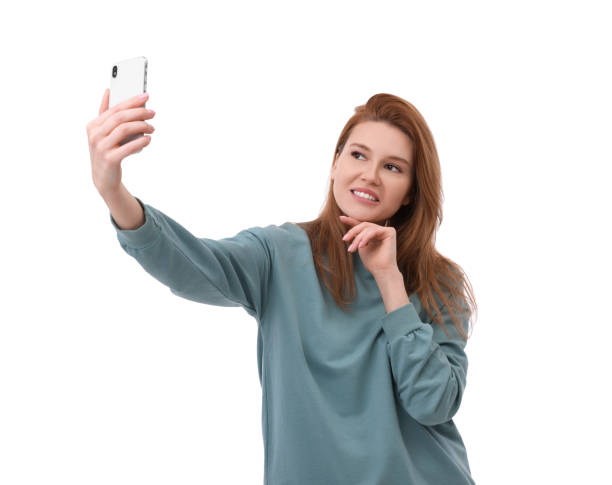 istock Beautiful woman taking selfie on white background 1683226595