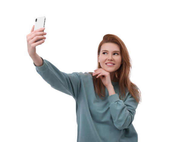 istock Beautiful woman taking selfie on white background 1683226598